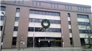 A large holiday wreath hanging on a public building 2