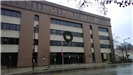 A large holiday wreath hanging on a public building