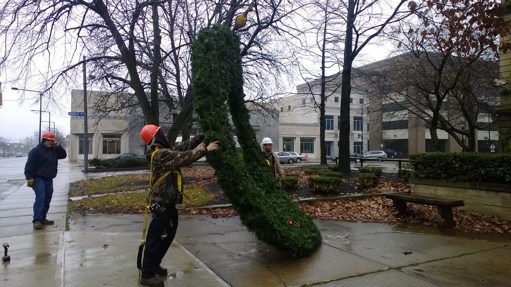 Picking up a large holiday wreath with a crane 2
